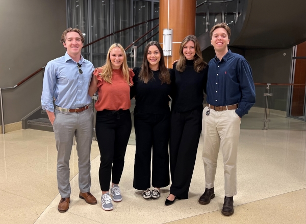 LSU Center for Internal Auditing & Cybersecurity Risk Management students pose for a group photo after a presentation to businesses.
